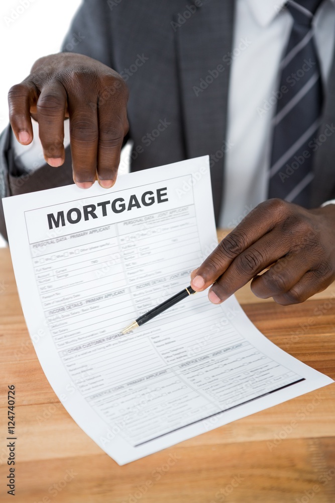 Businessman showing mortgage document Businessman showing mortgage document
