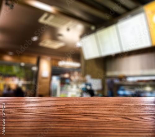 Fototapeta Naklejka Na Ścianę i Meble -  Wood table top on blurred coffee cafe vintage wooden decorate