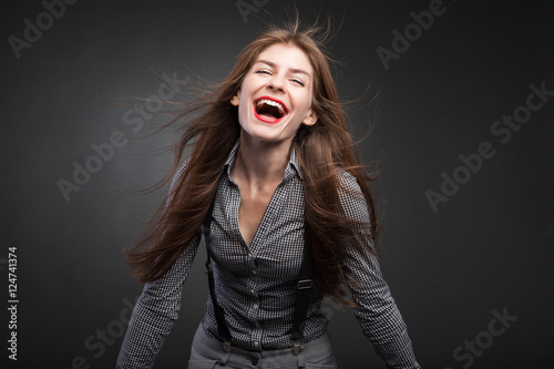 Beautiful women smiling with flying hair.