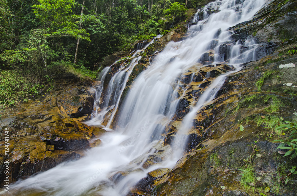 beautiful in nature, amazing cascading tropical waterfall. wet a beautiful in nature, amazing cascading tropical waterfall. wet a