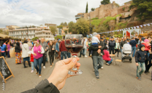 Many people with families walking the celebration streets with wine during festival Tbilisoba. Tbilisi, Georgia country