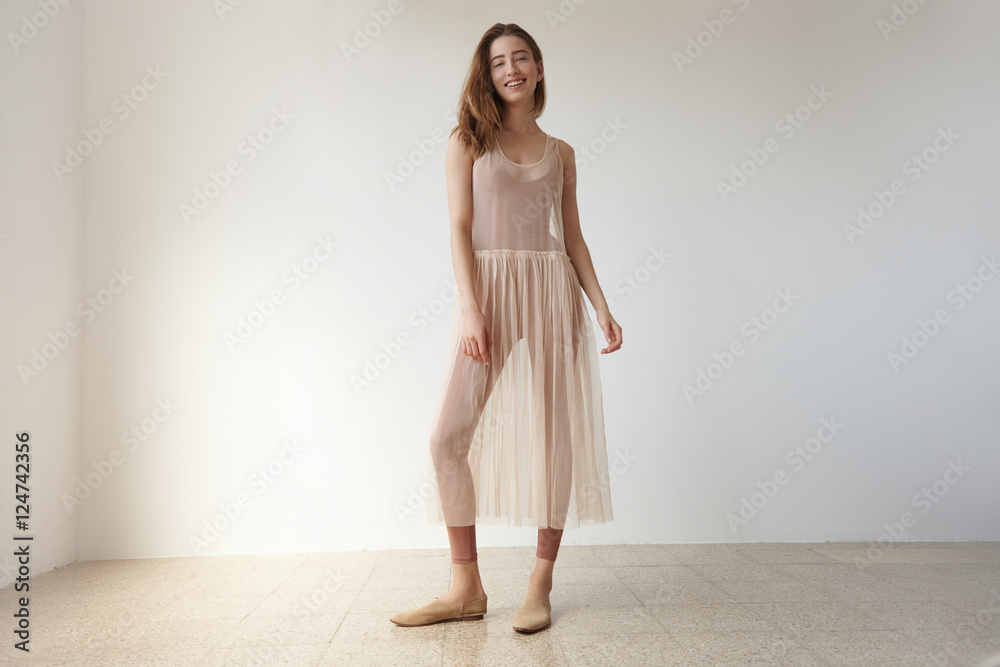 woman in loft studion in transparent ballerina's dress woman in loft studion in transparent ballerina's dress