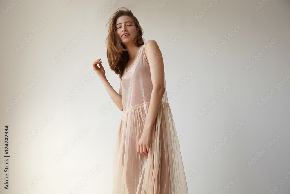 Fototapeta premium smiling woman's portrait in transparent dress