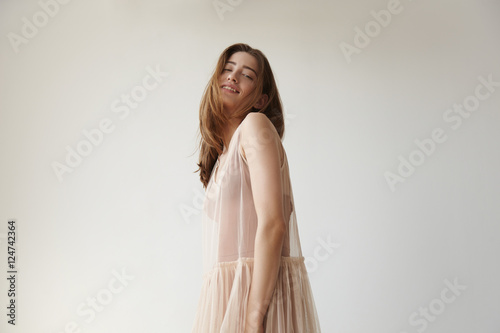 smiling woman's portrait. delicate soft light from window