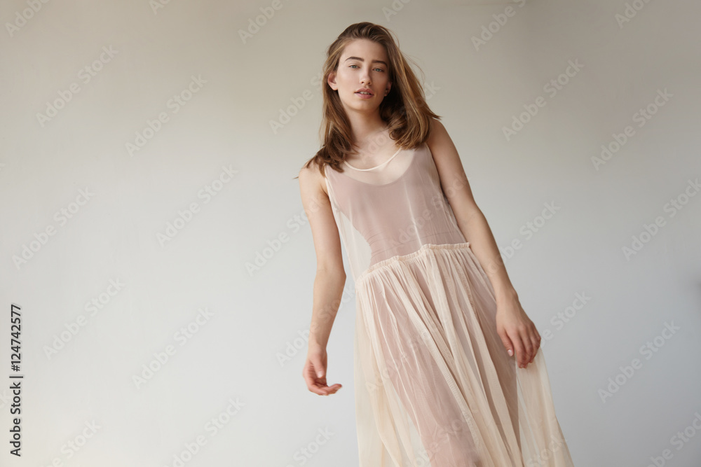 caucasian woman's portrait with soft day light and pale colours caucasian woman's portrait with soft day light and pale colours