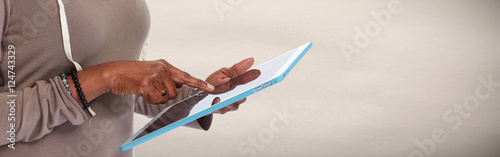 Hands with tablet computer.