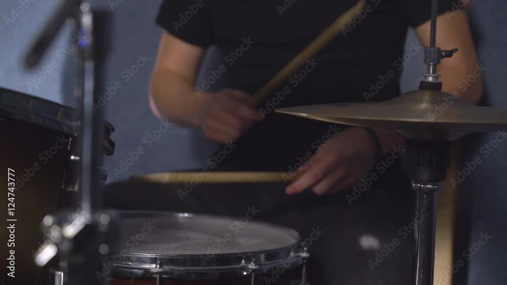 Drum set close up man’s hands beating rhythm. Man using drumsticks play on drums kit. Invisible guy on the concert or run-through. Details musician. Drum set close up man’s hands beating rhythm. Man using drumsticks play on drums kit. Invisible guy on the concert or run-through. Details musician.