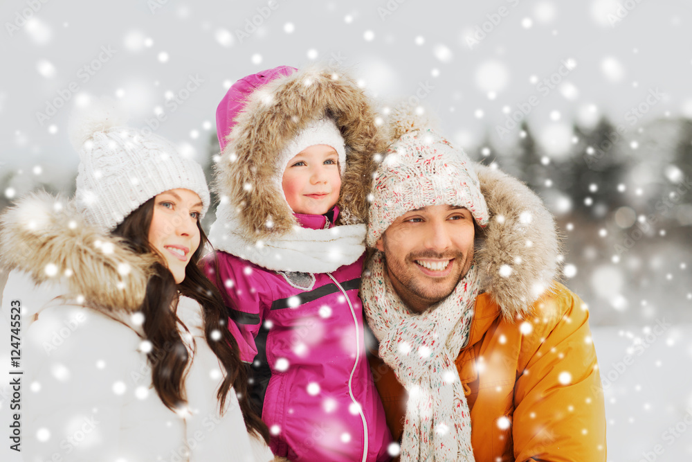 happy family with child in winter clothes outdoors happy family with child in winter clothes outdoors