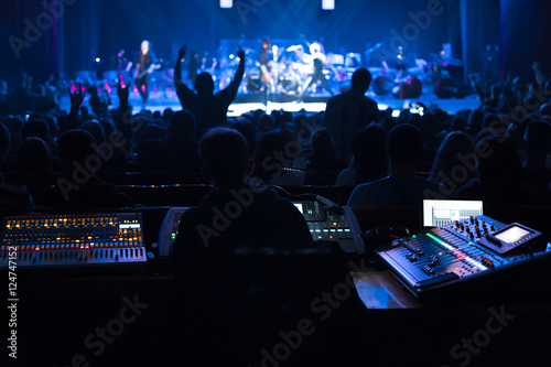 Obraz na płótnie Soundman working on the mixing console.