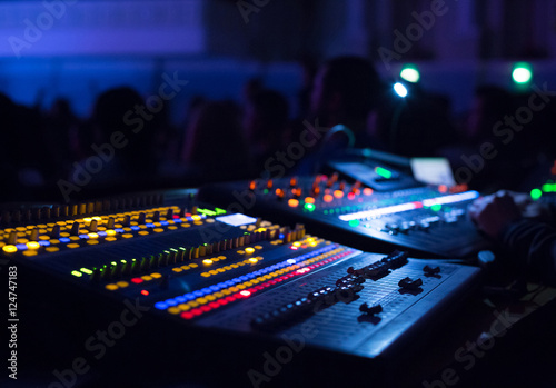 Obraz na płótnie Soundman working on the mixing console.