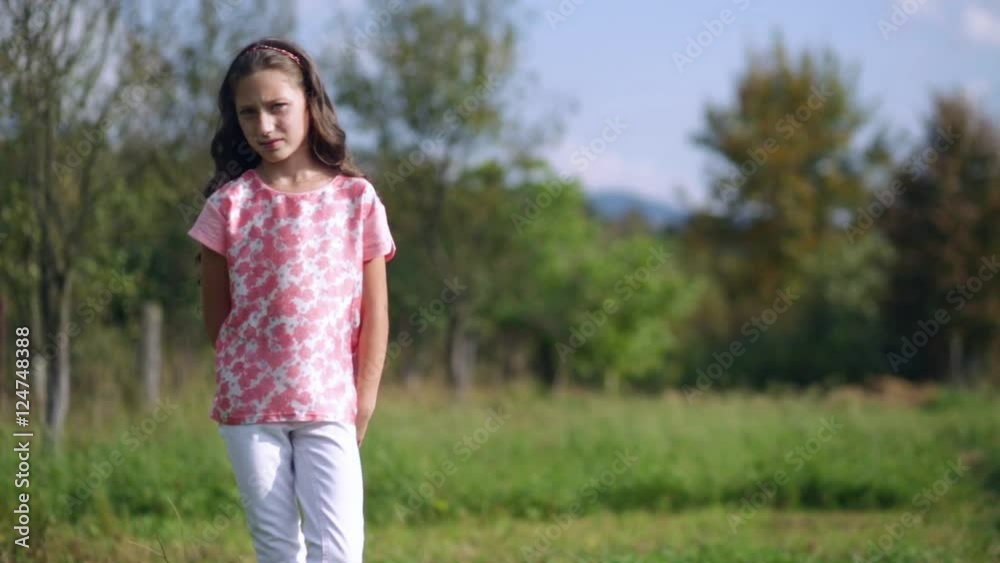 Beautiful sad little girl standing on a nature Beautiful sad little girl standing on a nature