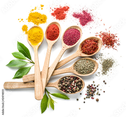 Fototapeta Naklejka Na Ścianę i Meble -  Assortment of colorful spices in the wooden spoons on the white