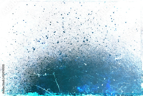 Fotografie Abstract blue paint splashes and droplets texture on white background