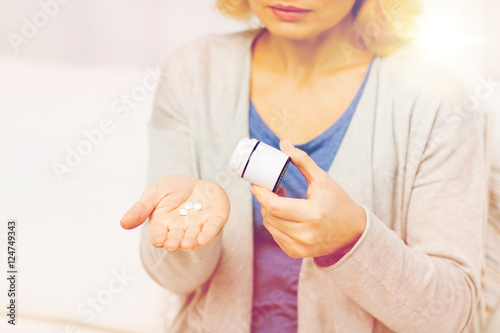 close up of woman with medicine at home