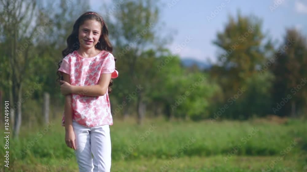 beautiful little girl waving hand on nature beautiful little girl waving hand on nature