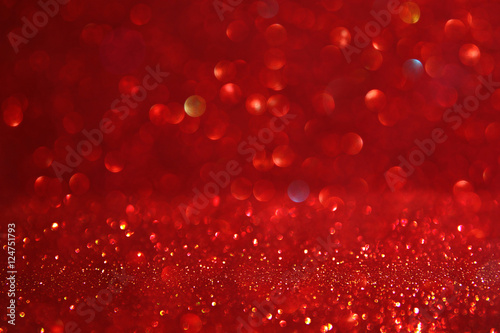 Red glitter vintage lights background. defocused.