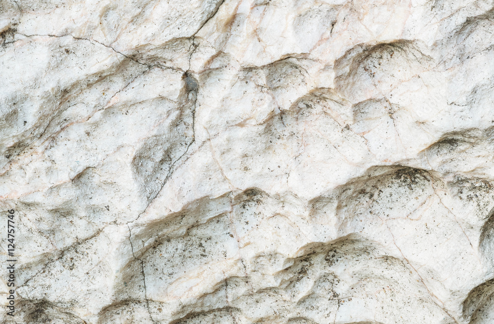 Obraz premium Closeup surface of stone pattern at big rock for decoration in the garden textured background