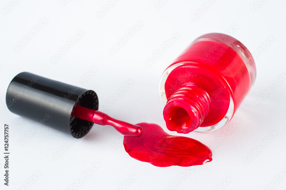 Open red nail polish. On white, isolated background. Open red nail polish. On white, isolated background.