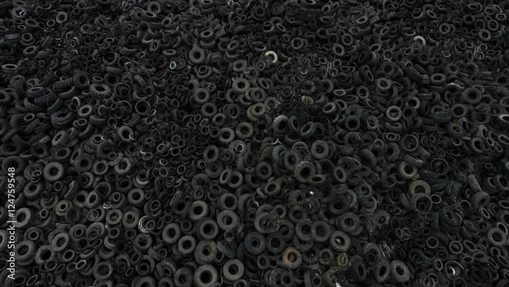 Aerial view old rubber, tyre tire, wheel of cars in recycling factory 4k