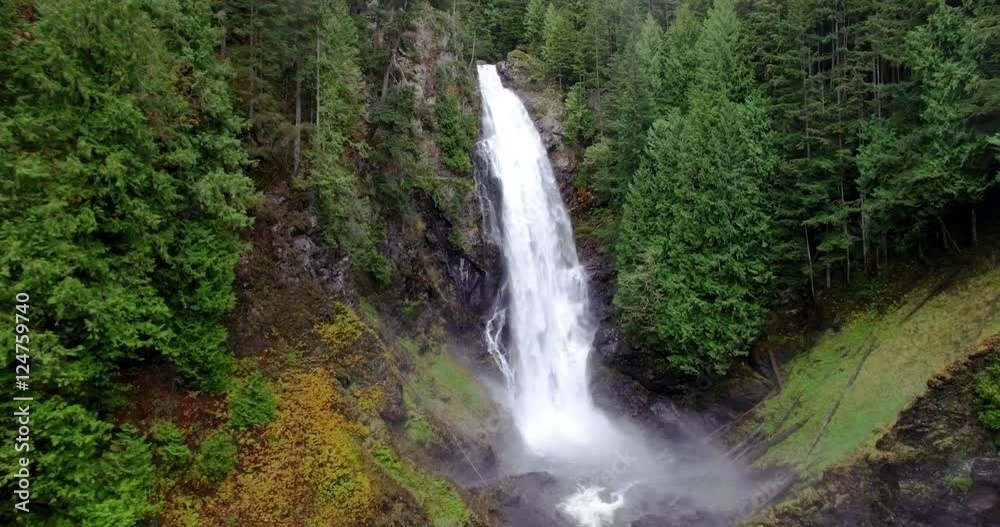 Flying Towards Flowing Waterfalls in Cascade Mountains Forest Flying Towards Flowing Waterfalls in Cascade Mountains Forest