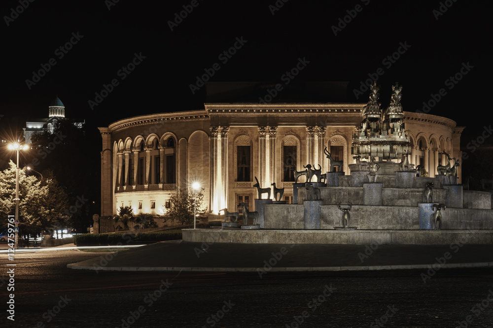 Center of the city of Kutaisi, Georgia. In terms of the main area of David the Builder and Colchis fountain, drama theater and in the background Bagrati Cathedral plan.night black and white photo