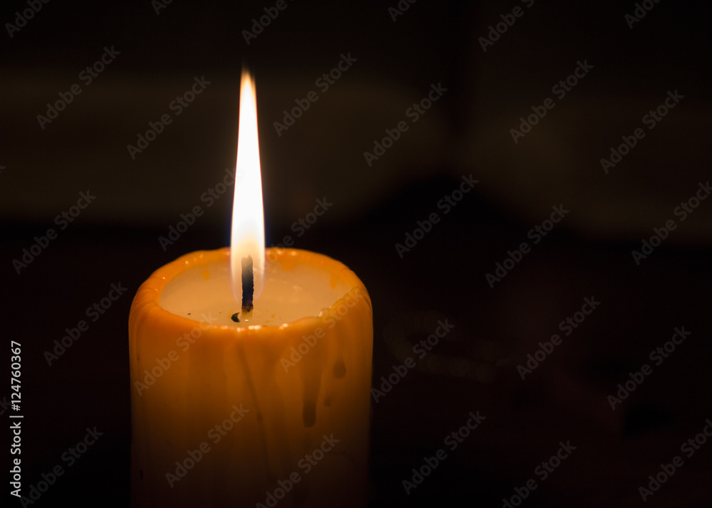 Candle light over black background Candle light over black background
