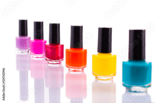 Many multi-colored nail polish. On white, isolated background.