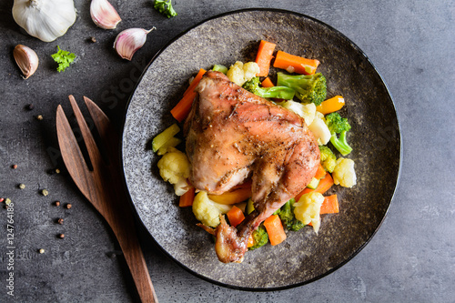 Roasted chicken leg with steamed vegetable