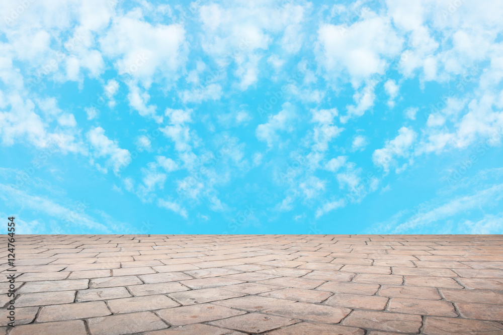 Pattern of floor tile with blue sky and clouds.
