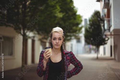 Woman standing with coffee cup © WavebreakmediaMicro