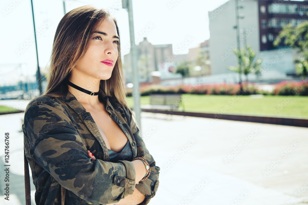 Fototapeta premium Beautiful young woman posing in the street.