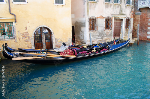 Gondolas in Venice in the narrow channel, Italy. © mihakonceptcorn