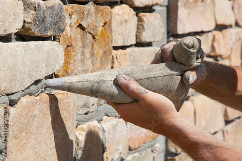 Billede på lærred masonry contractor grouting joints in veneer