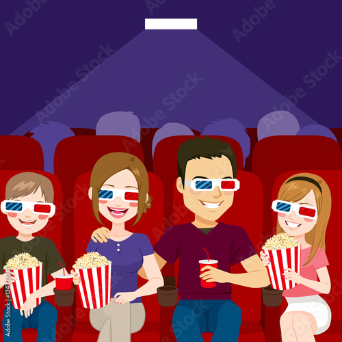 Family watching a movie at ...