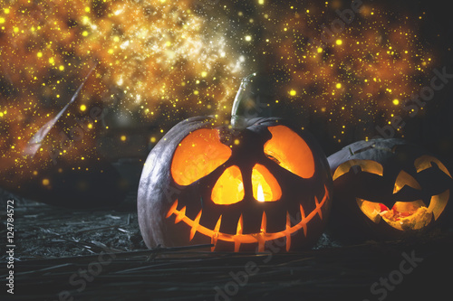 Halloween pumpkins at wood background.