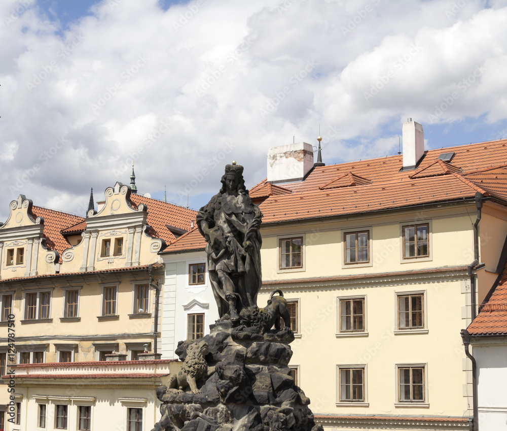 Baroque Statues on the Prague Charles Bridge with beautiful Castle