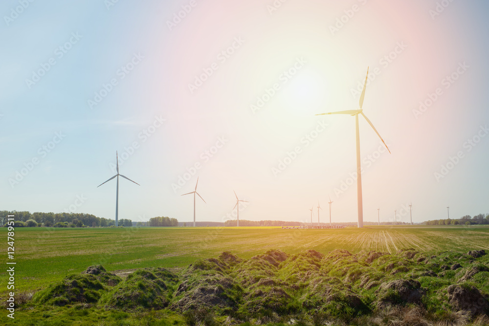 Obraz premium Bright blue sky moving and wind turbine