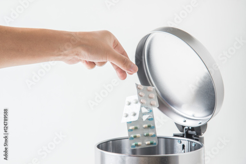 throwing away medecine in trashcan