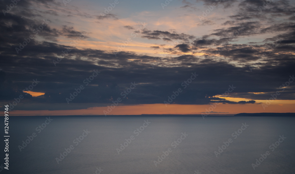 Naklejka premium Seascape of sunset and ocean. Whitsands Bay, Cornwall, UK.