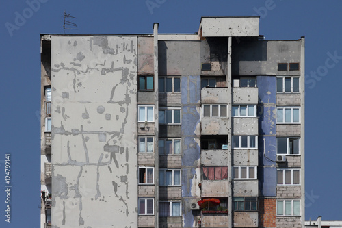 Scars of war at the apartment block in Sarajevo photo