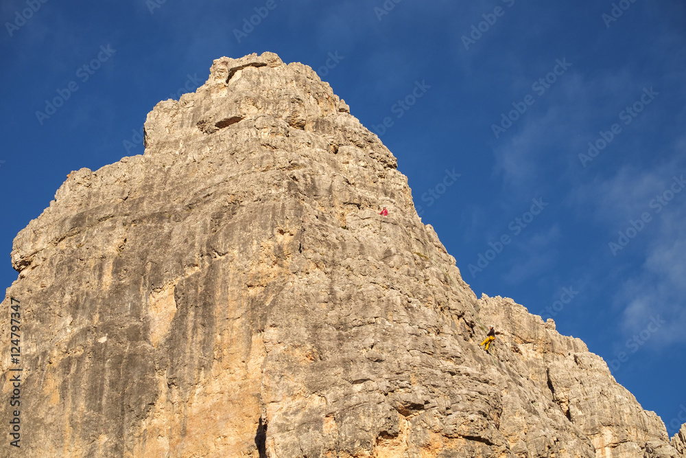 Vertical walls with climber Cinque Torri