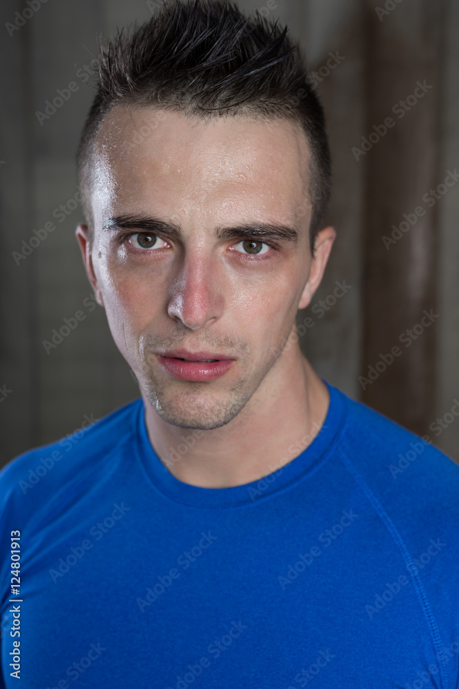 fitness shaped muscle man posing on rustic background fitness shaped muscle man posing on rustic background