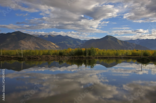 trees reflection mtns n clouds © danheller