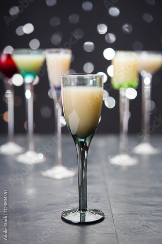 eggnog in liqueur glasses on a dark background 