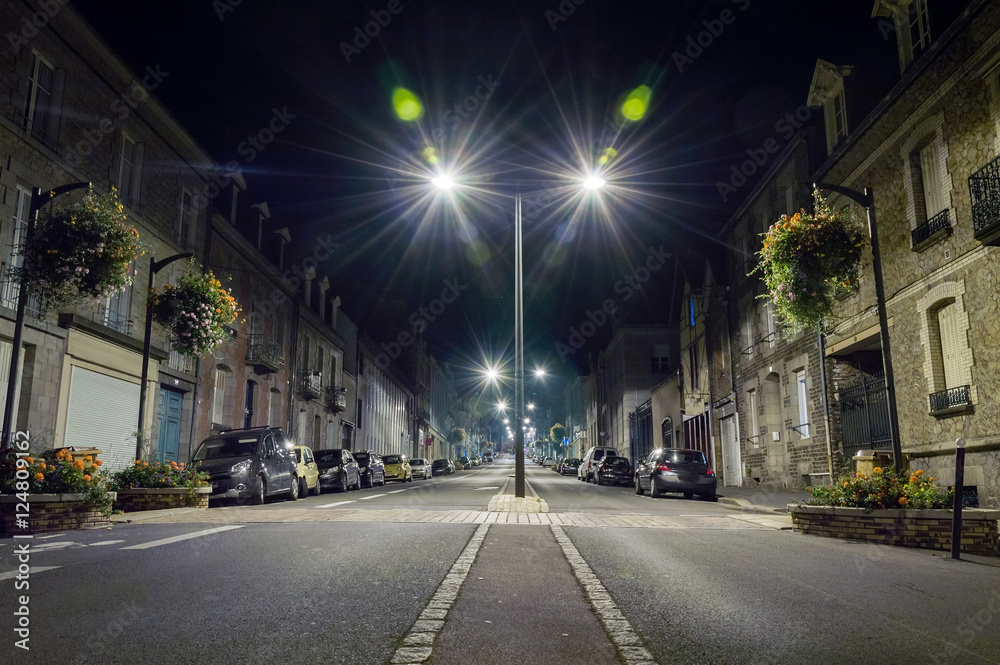 Narrow street in european city at night.