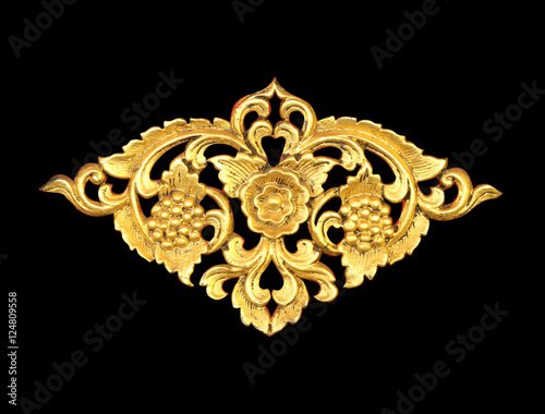 Pattern of wood carve gold paint for decoration on black backgro