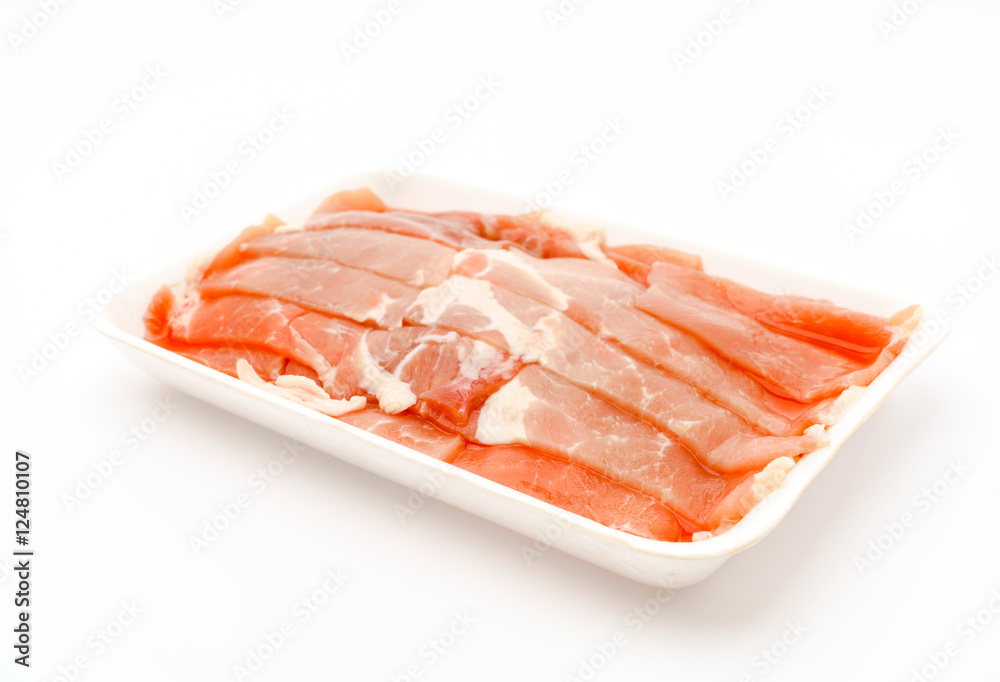Slide of  raw pork  on white background .