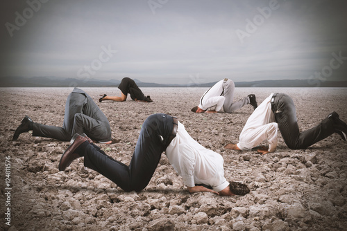 Bild auf Leinwand Fear of crisis with businesspeople like an ostrich