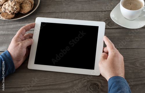 Man works with the use of the tablet