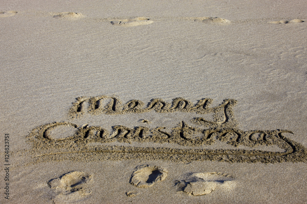 Fototapeta premium merry-christmas sand writing